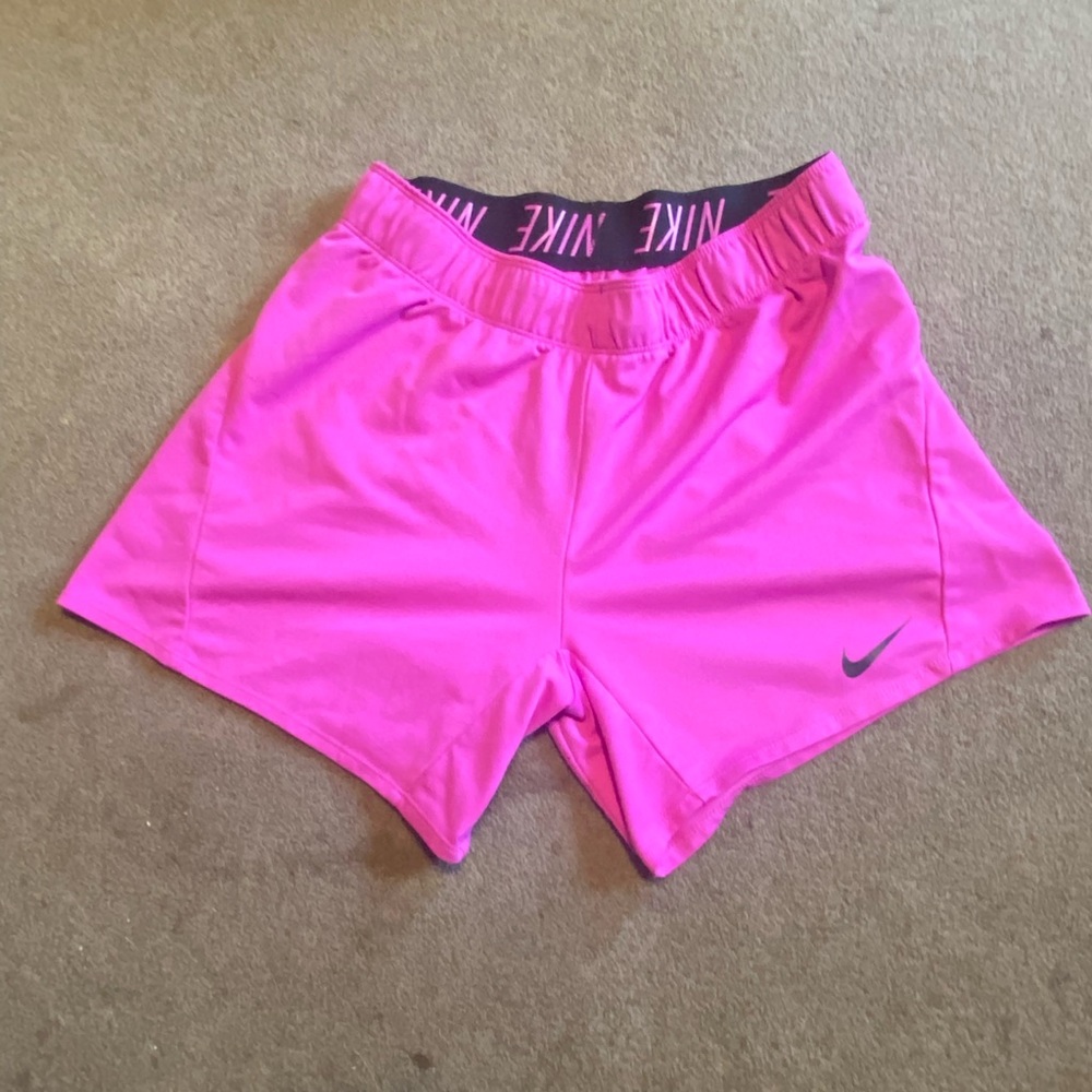 Women Nike athletic shorts. Size small. Magenta color.